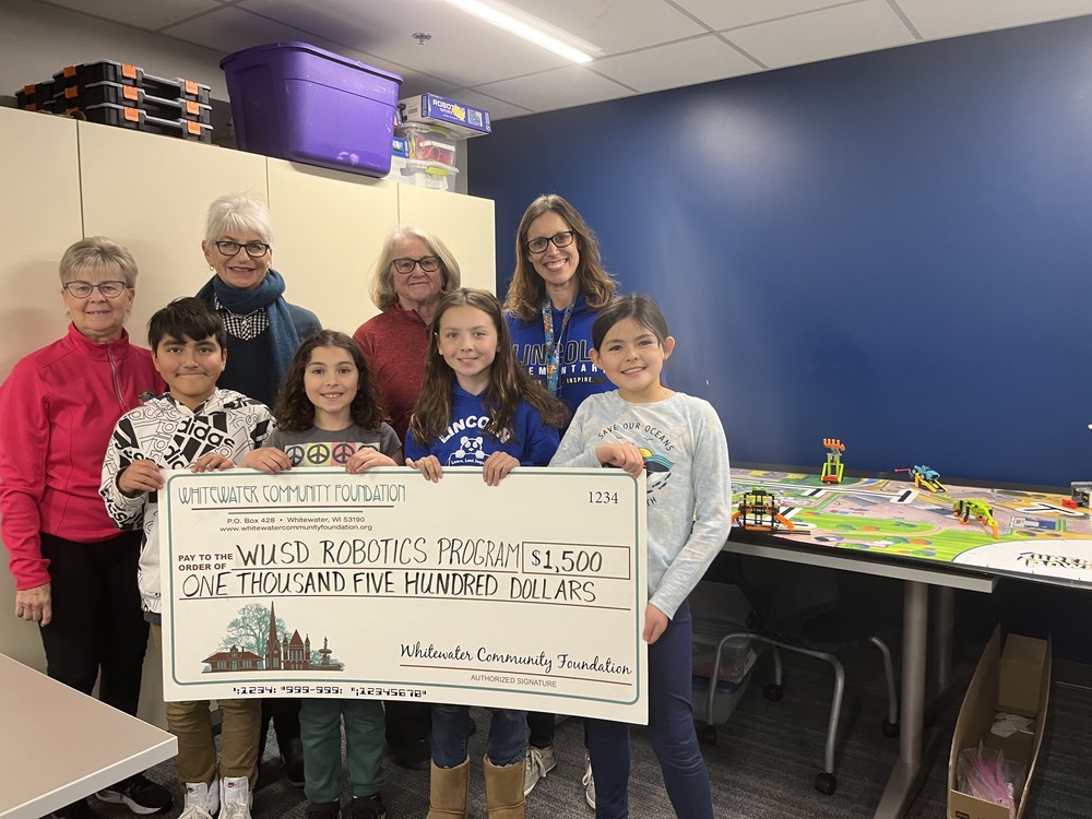 kids with donation check