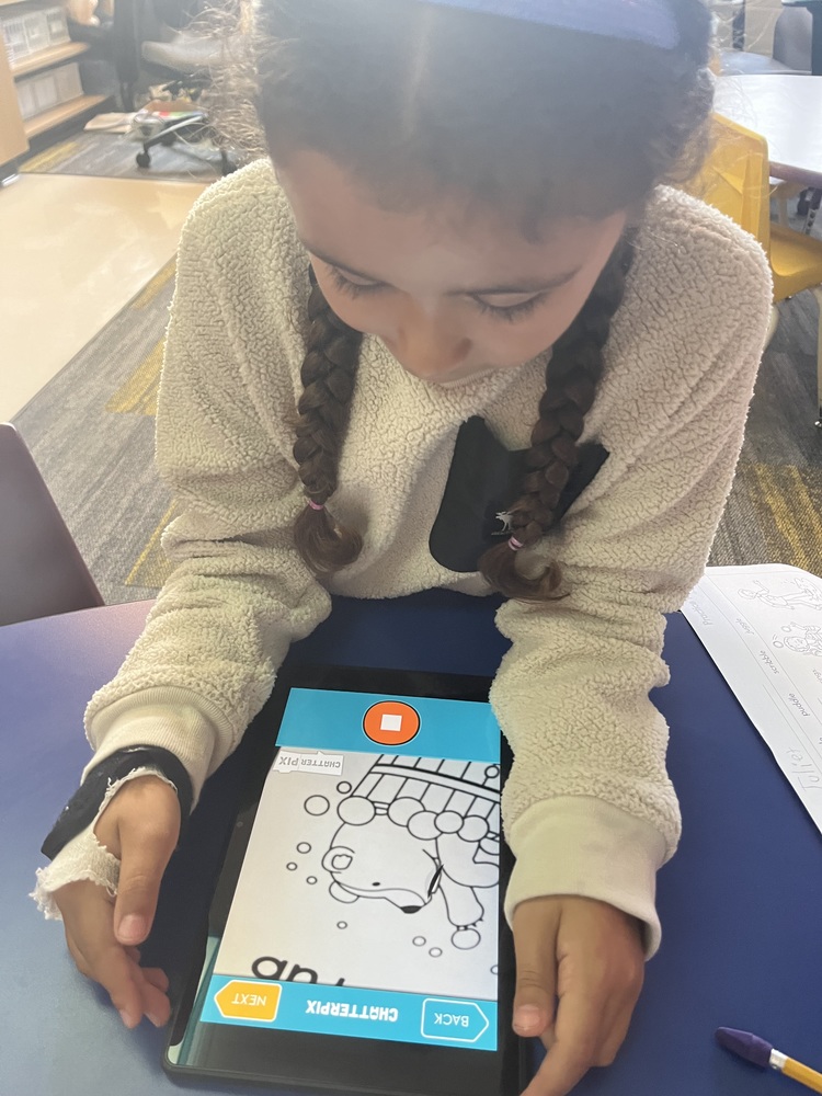 student looking at chatterpix app